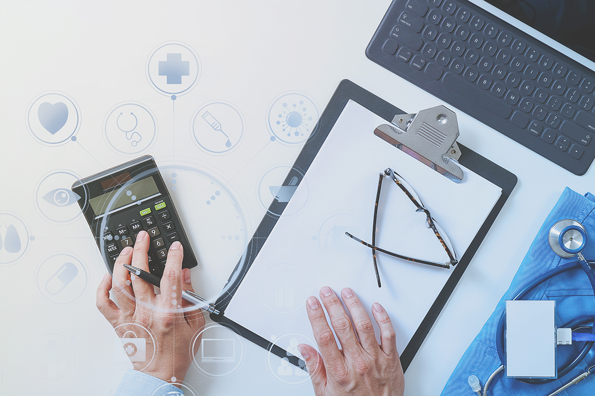 Desktop computer, calculator, clipboard, glasses and stethoscope surrounded by different heathcare related icons